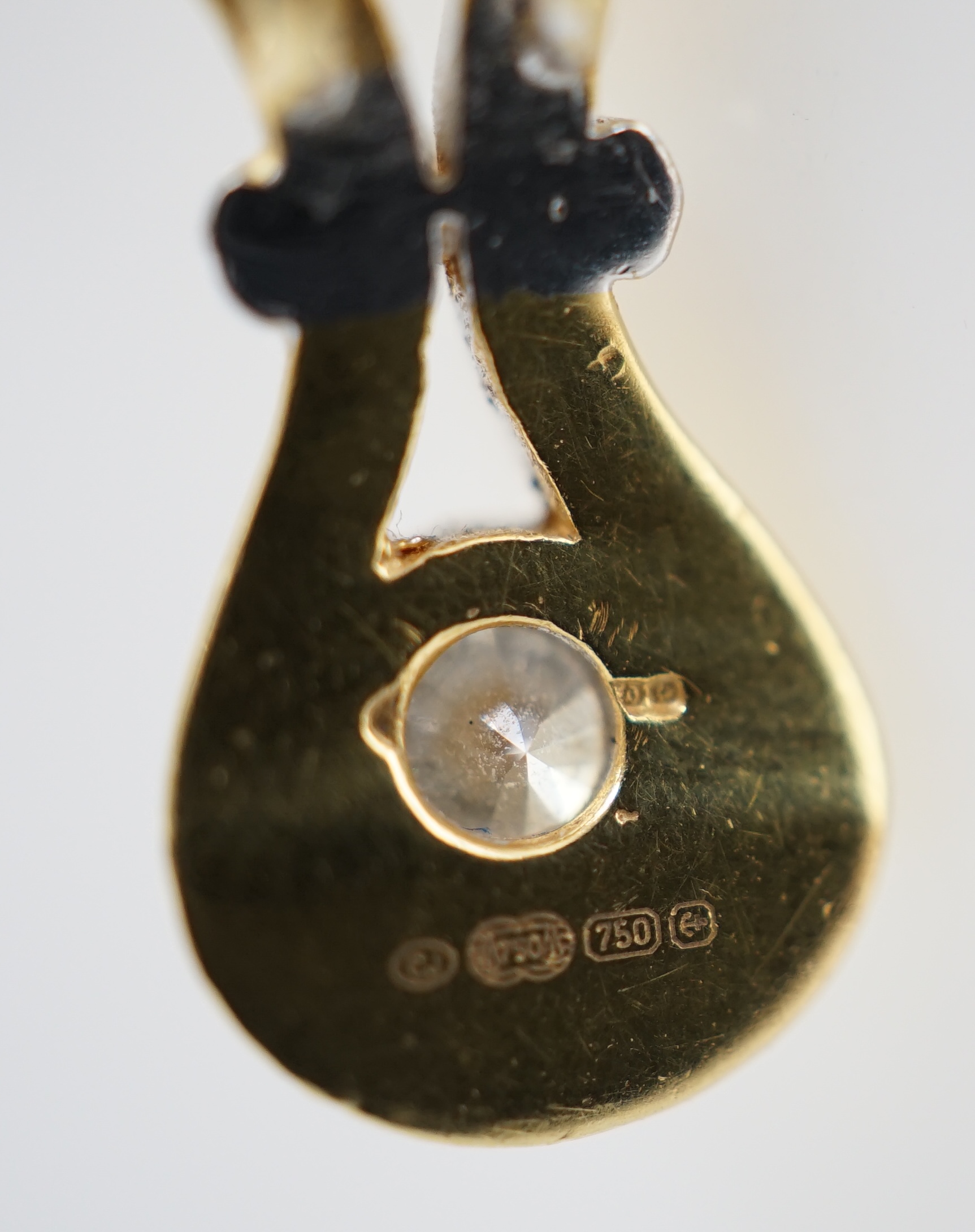 A modern 18ct gold and solitaire diamond set pendant, on an 18ct gold fine link chain